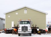 Built house on trailer ready to be brought to its destination.